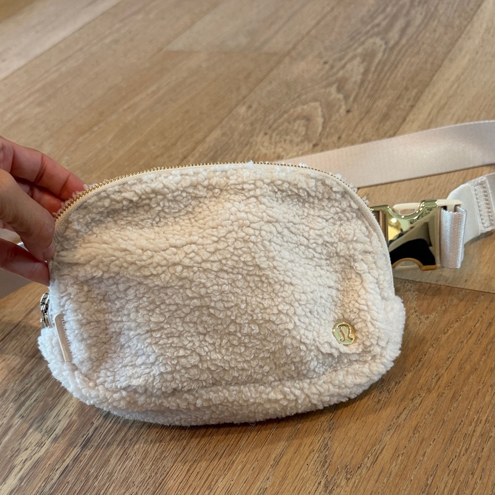 lululemon athletica Cream Sherpa Waist Bag with Gold Hardware
